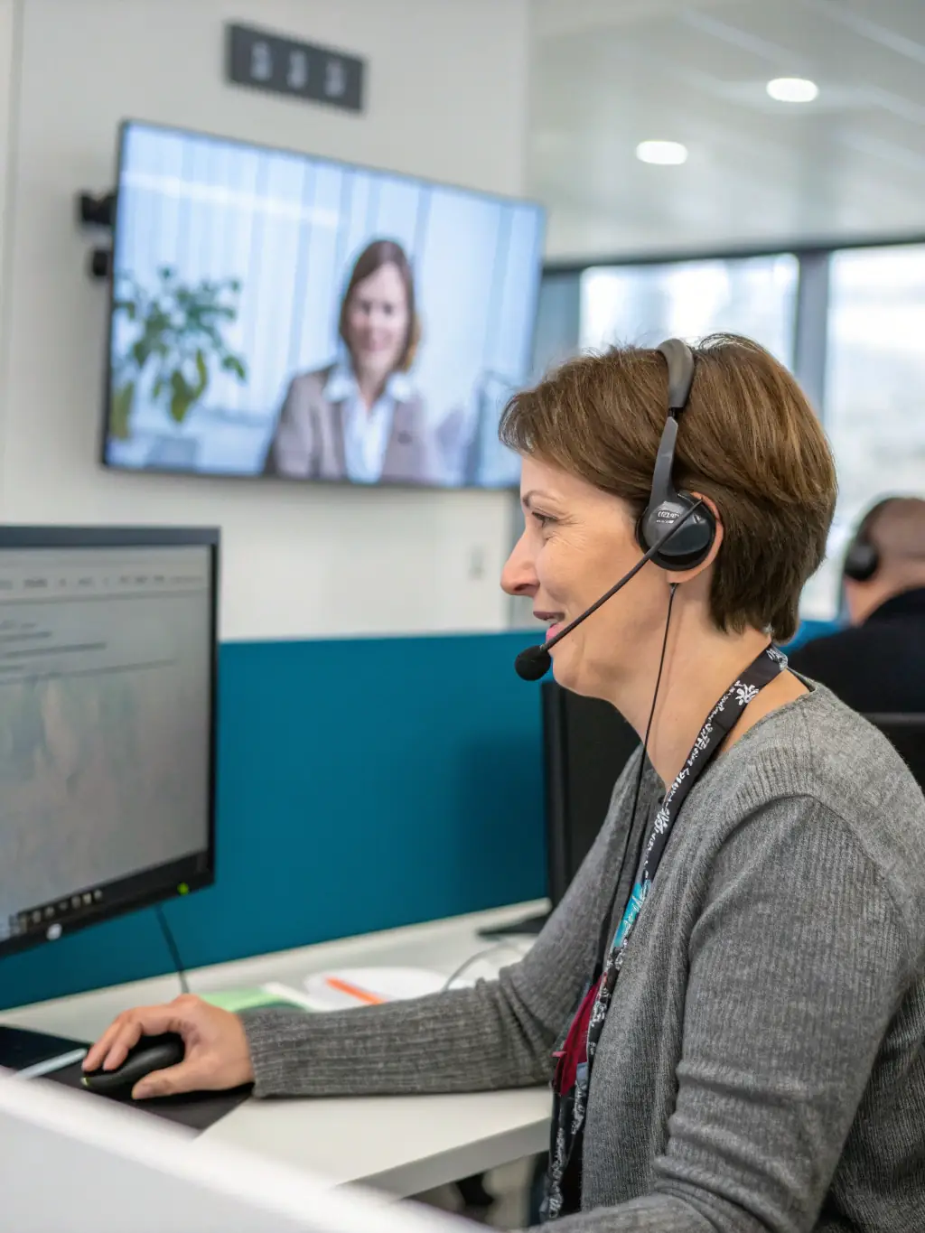 A person in a business suit having a video call with a client, representing the 'Premium' package's dedicated account manager and priority support.
